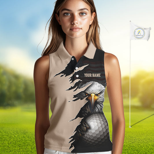 Women wearing a Personalized Eagle Golf Sleeveless Polo Shirt featuring a fierce bald eagle holding a golf ball, distressed American flag design, custom name and team name, beige and black performance golf jersey for women.