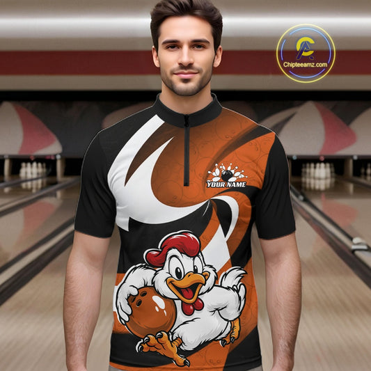 A man wearing a short-sleeve quarter-zip athletic jersey with a black, orange, and white graphic design featuring a cartoon chicken holding a bowling ball. The jersey has a placeholder logo on the chest and is shown against a blurred bowling alley background.