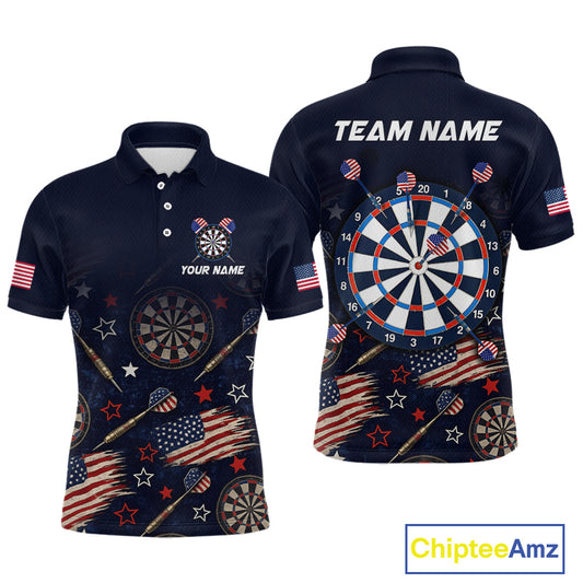 Front and back views of a navy blue short-sleeve polo shirt with a patriotic darts theme, featuring American flags, stars, darts, and a large dartboard graphic on the back. The shirt includes customizable text placeholders 'YOUR NAME' and 'TEAM NAME'.