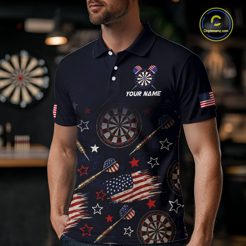 A man wearing a dark navy polo shirt with a patriotic darts and American flag theme, featuring dartboard graphics, stars, and flag patterns. The shirt has a custom name placeholder on the chest.
