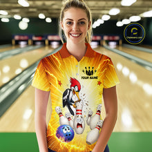 Load image into Gallery viewer, Woman wearing a bowling-themed shirt with a woodpecker design in a bowling alley.