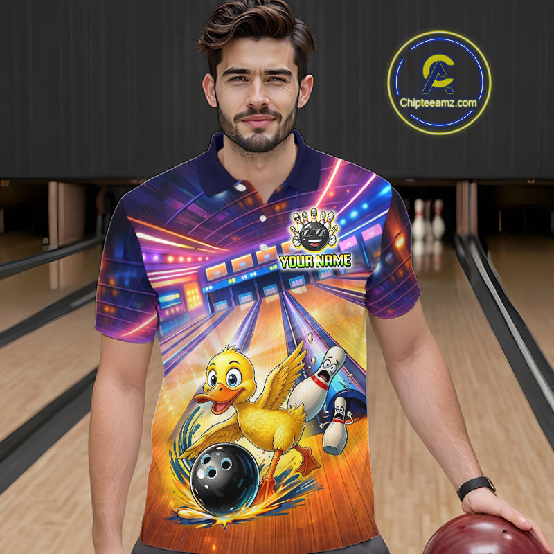 Man wearing a colorful bowling-themed shirt with a duck graphic in a bowling alley.