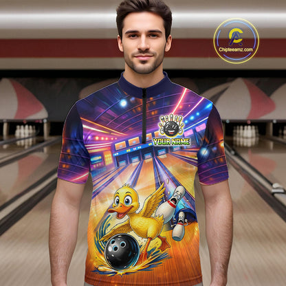 Man wearing a colorful bowling-themed shirt with a cartoon duck character in a bowling alley.