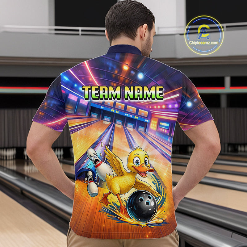 Person wearing a colorful bowling shirt with a duck character and 'Team Name' text in a bowling alley.
