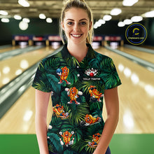 Load image into Gallery viewer, Woman wearing a colorful bowling shirt with cartoon characters in a bowling alley.