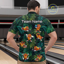 Load image into Gallery viewer, Person wearing a colorful bowling shirt with cartoon characters and 'Team Name' text, standing in a bowling alley.