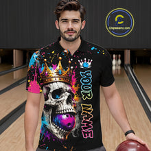 Load image into Gallery viewer, Man wearing a colorful bowling shirt with a skull design in a bowling alley.