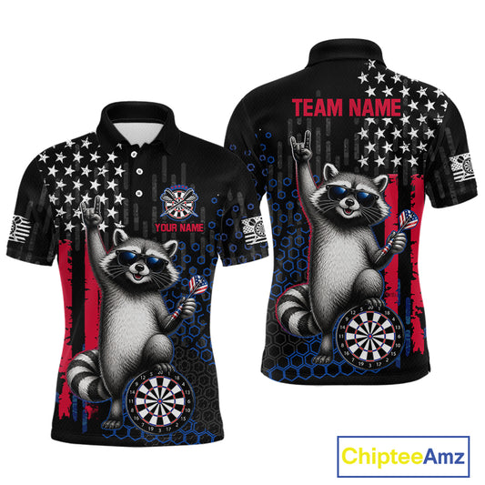 Front and back views of a black short-sleeve polo shirt featuring a raccoon graphic, stars, red and blue flag elements, dartboard designs, and customizable text areas including 'TEAM NAME' and 'YOUR NAME'.