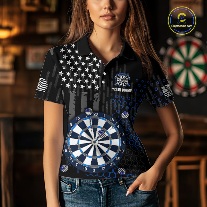 Female model wearing a custom black darts polo shirt featuring an grey American flag star pattern, a large dartboard graphic, and customizable 'YOUR NAME' text on the chest