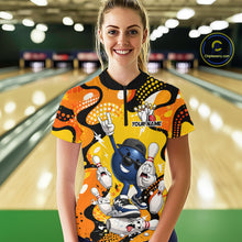 Load image into Gallery viewer, Person wearing a colorful bowling-themed shirt with cartoon characters in a bowling alley.