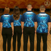 Load image into Gallery viewer, Four people wearing blue bowling shirts with a team name on a bowling alley.