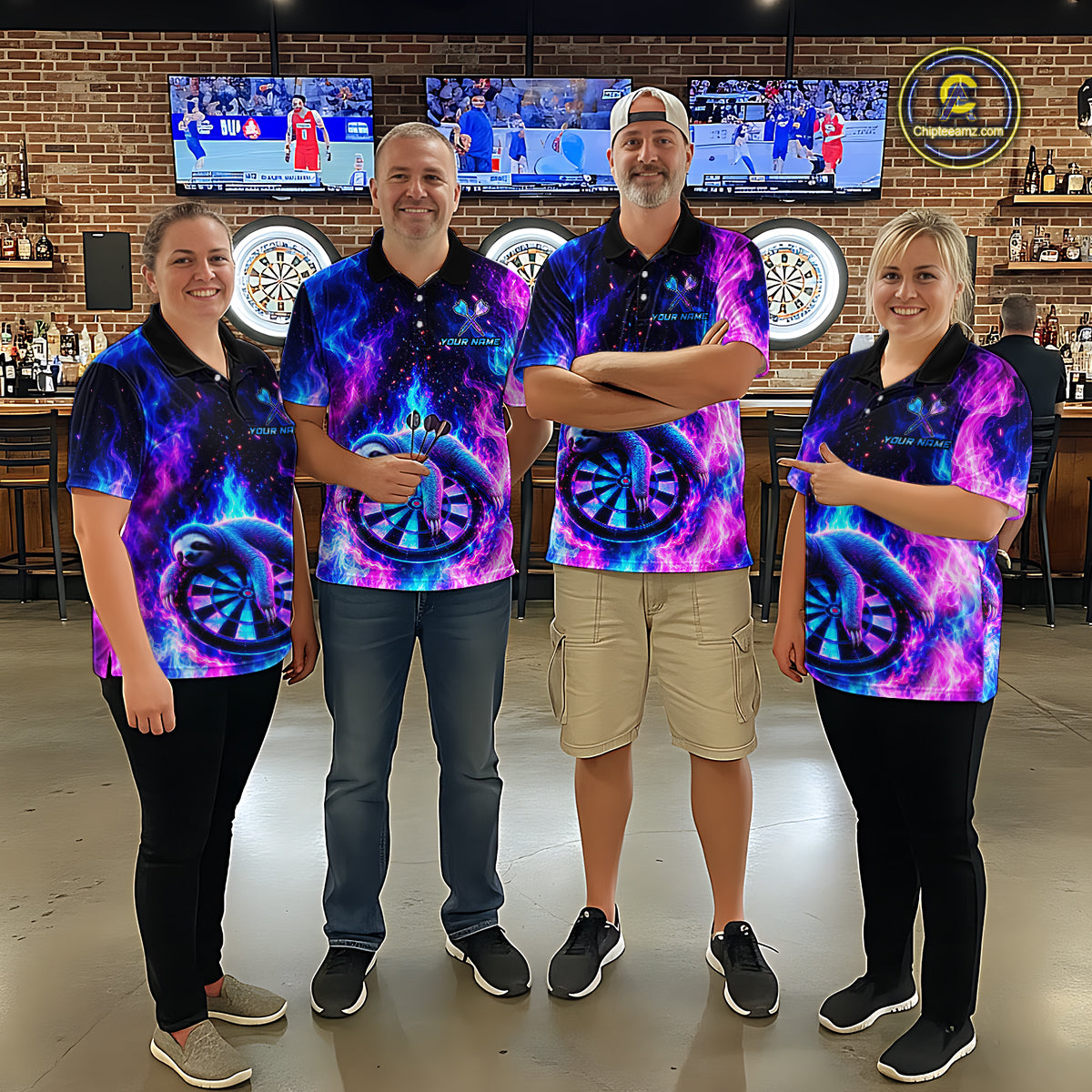 Group of four wearing matching custom galaxy dart polo shirts featuring neon sloths holding dartboards with glowing blue and purple cosmic artwork in a professional dart room.