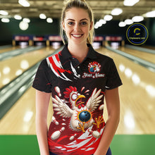Load image into Gallery viewer, Woman wearing a black bowling shirt with a colorful chicken design in a bowling alley.