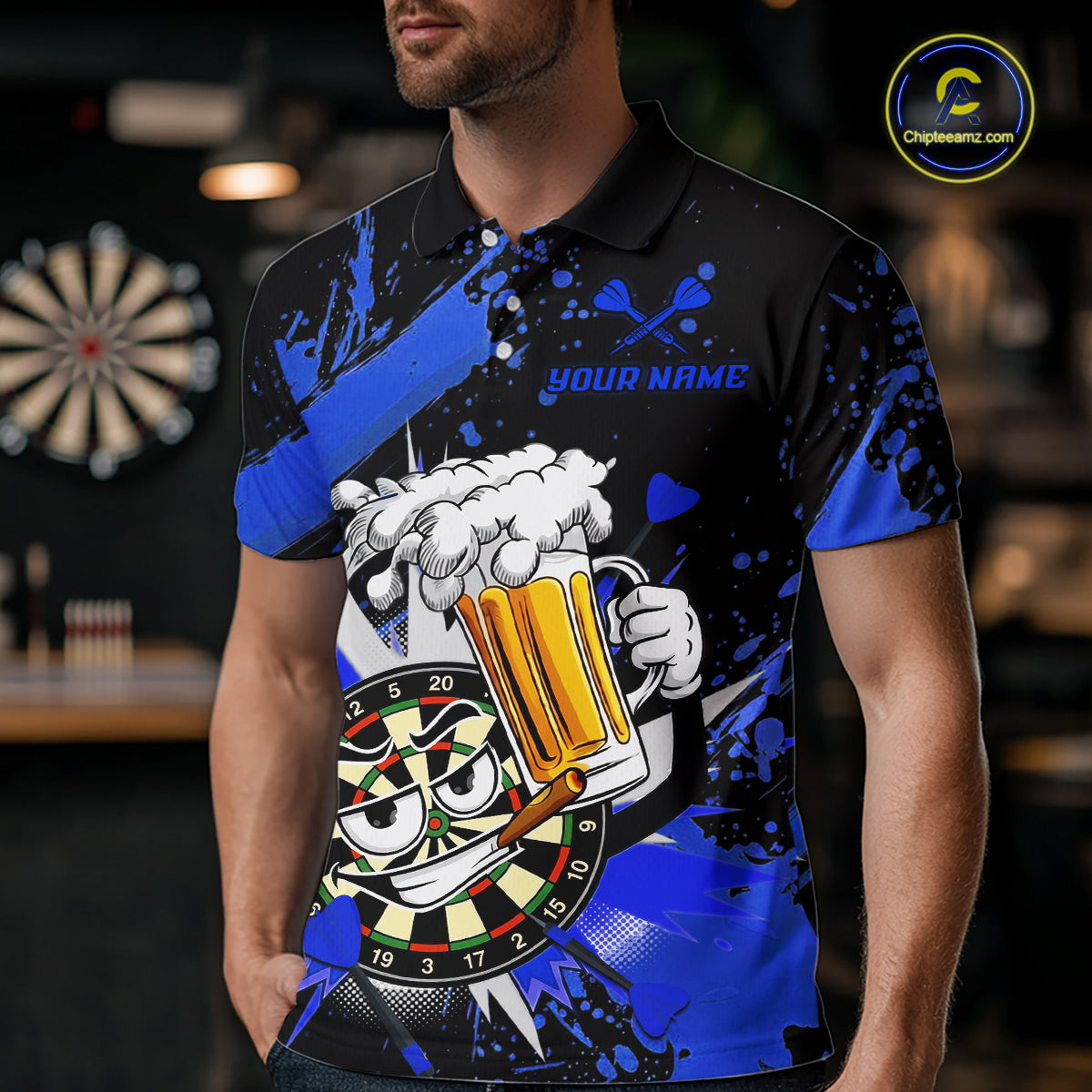 A man wearing a black and neon blue short-sleeve polo shirt with a darts and beer-themed graphic print. The shirt features a cartoon dartboard face, a foaming beer mug, crossed darts, and the text 'YOUR NAME' on the chest.
