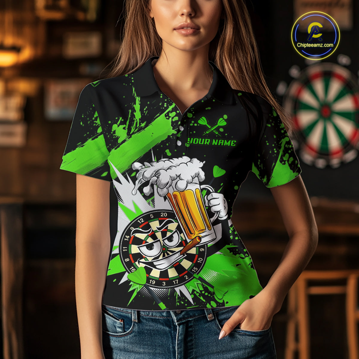 A woman wearing a black short-sleeve polo shirt with a bright green and white graphic design featuring a cartoon dartboard and beer mug, set against a blurred bar background.