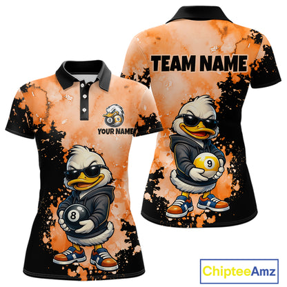 Customizable short-sleeve polo shirt shown from the front and back, featuring a cartoon duck character in a black jacket holding billiard balls, with an orange and black splattered background and placeholder text 'TEAM NAME' and 'YOUR NAME'.