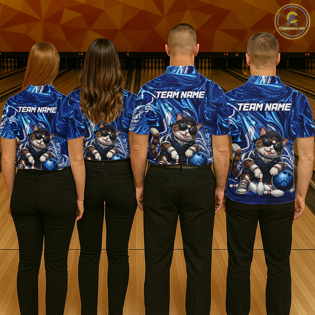 Four people wearing blue bowling shirts with a cat design on a bowling alley.