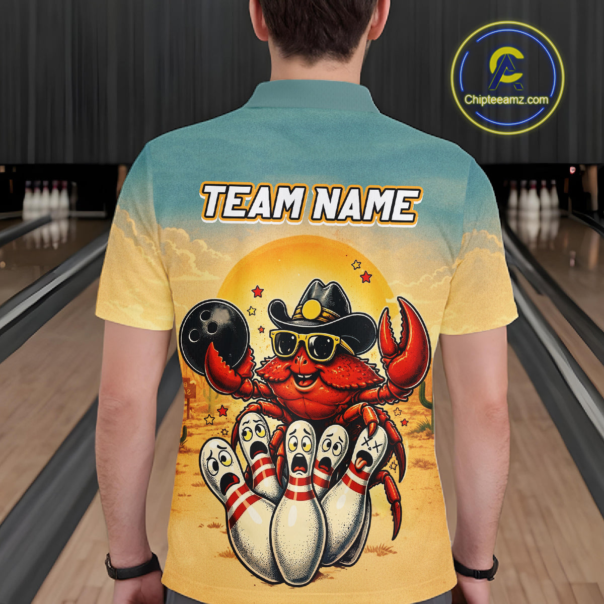 Person wearing a colorful shirt with a cartoon crab design and 'TEAM NAME' text in a bowling alley.