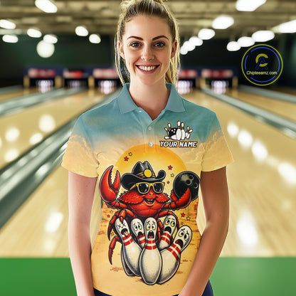 Person wearing a colorful shirt with a cartoon crab design in a bowling alley.