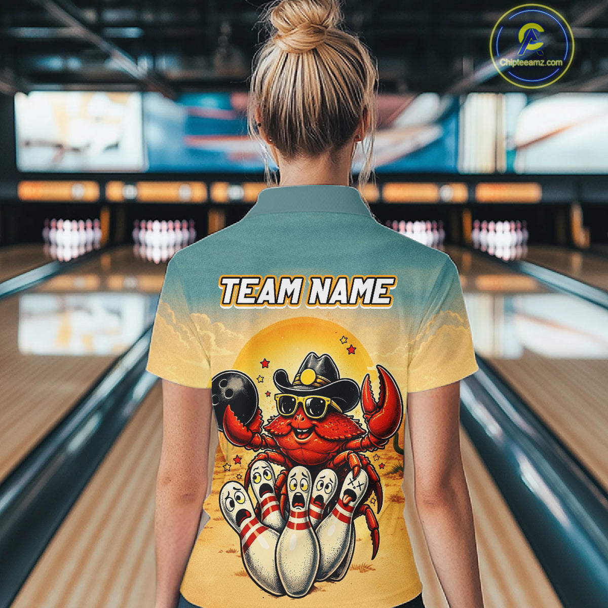 Person wearing a shirt with a colorful design of a crab bowling at a bowling alley.