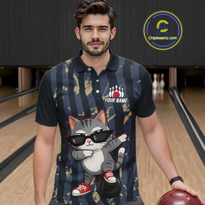Man wearing a bowling-themed shirt with a cat design in a bowling alley.