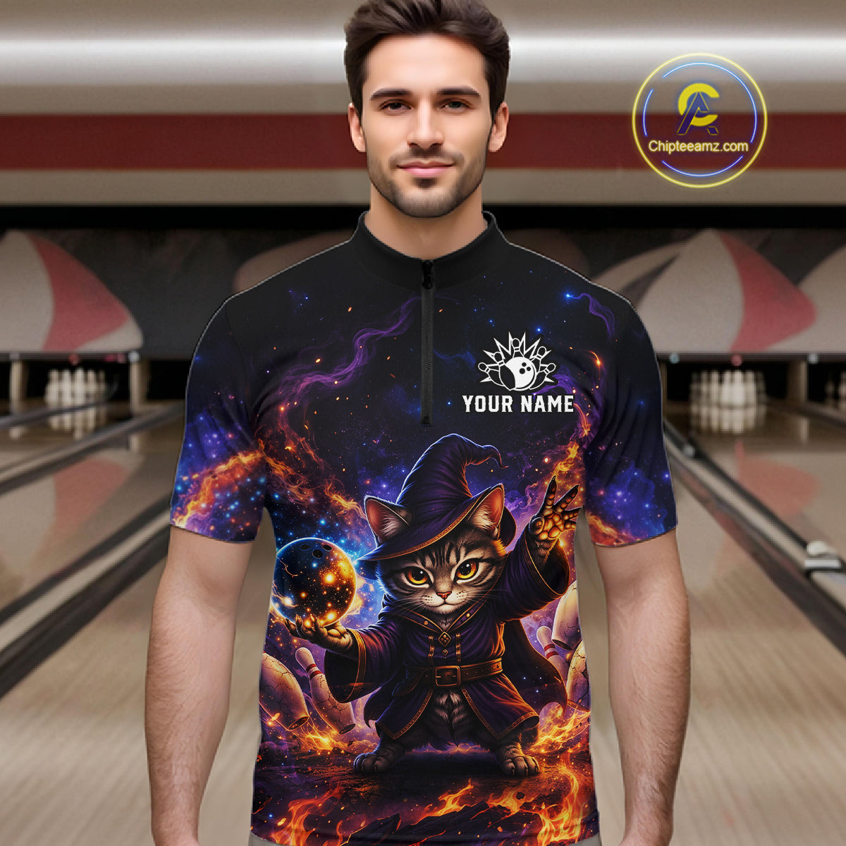 Man wearing a colorful shirt with a cat wizard design in a bowling alley.