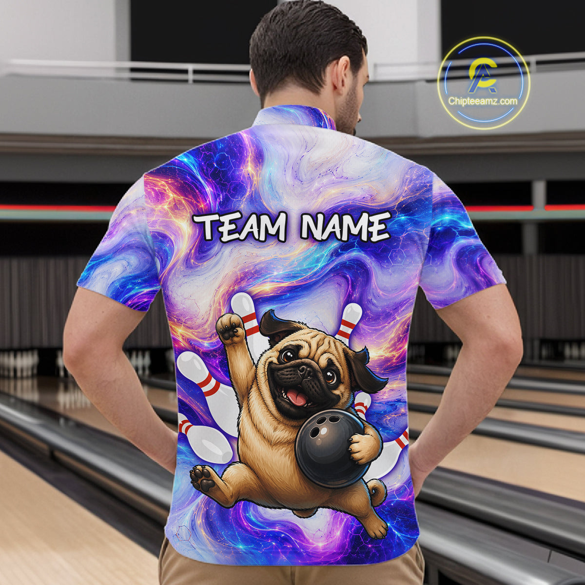 Person wearing a colorful shirt with a pug graphic and 'TEAM NAME' text in a bowling alley.