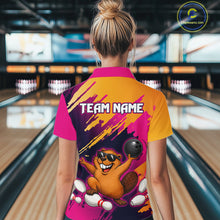 Load image into Gallery viewer, Person wearing a colorful bowling shirt with a team name design in a bowling alley.