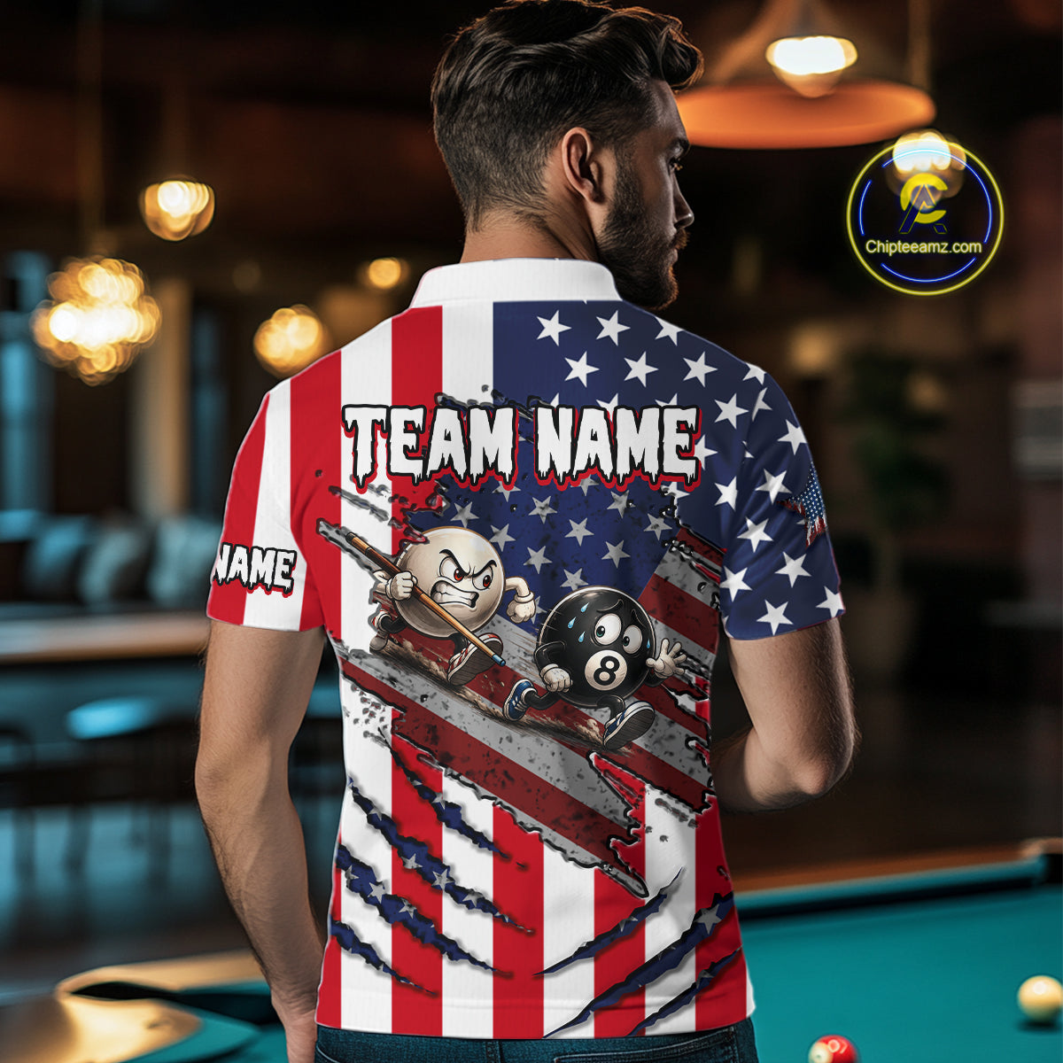 A man viewed from behind wearing a short-sleeve polo shirt with a patriotic American flag design and a large pool-themed graphic on the back. The shirt features red and white stripes, a blue field with white stars, and billiards elements including a cue stick, pool balls, and a broken dollar sign.