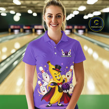 Load image into Gallery viewer, Woman wearing a purple bowling-themed shirt with cartoon characters in a bowling alley.