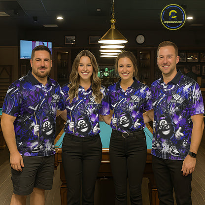 Four people wearing matching purple bowling shirts in a bowling alley.