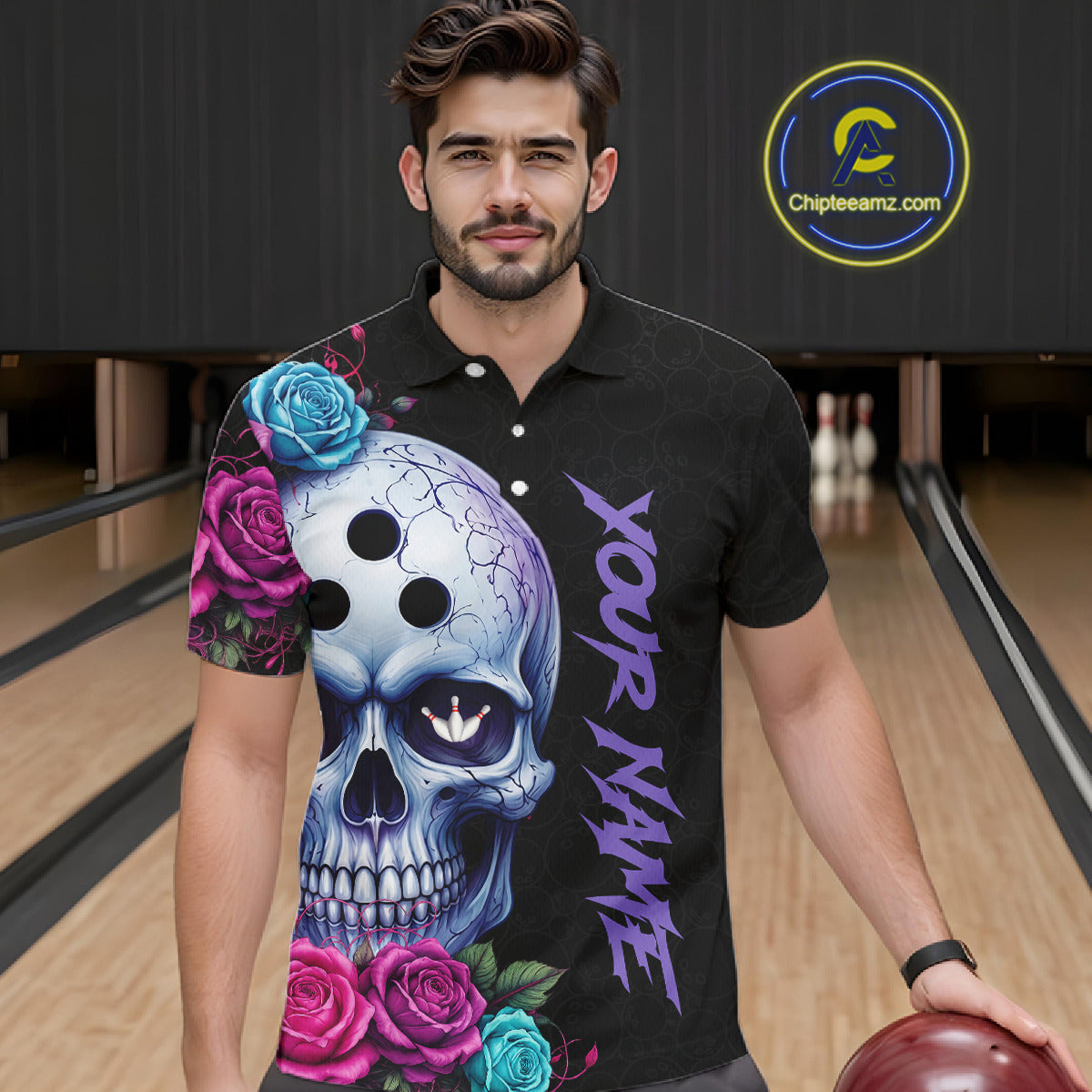 Man wearing a black polo shirt with a skull and floral design in a bowling alley.