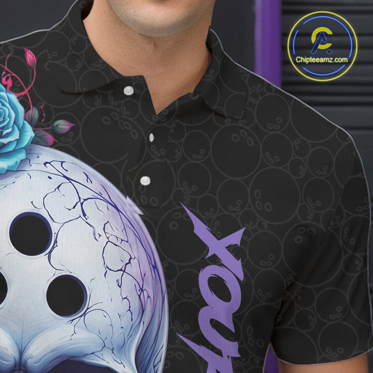 Person wearing a black polo shirt with a graphic design and customizable text.