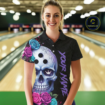 Woman wearing a black bowling shirt with a colorful skull design in a bowling alley.