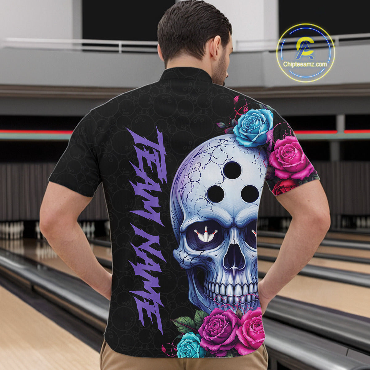 Person wearing a black jersey with a colorful skull design and 'Team Name' text at a bowling alley.