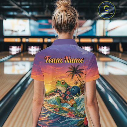 A woman viewed from behind in a bowling alley wearing a short-sleeve collared shirt with a colorful tropical frog surfing graphic and the words 'Team Name' across the upper back. 
