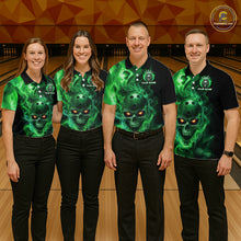 Load image into Gallery viewer, Four people wearing matching green and black shirts with a skull design on a bowling alley.