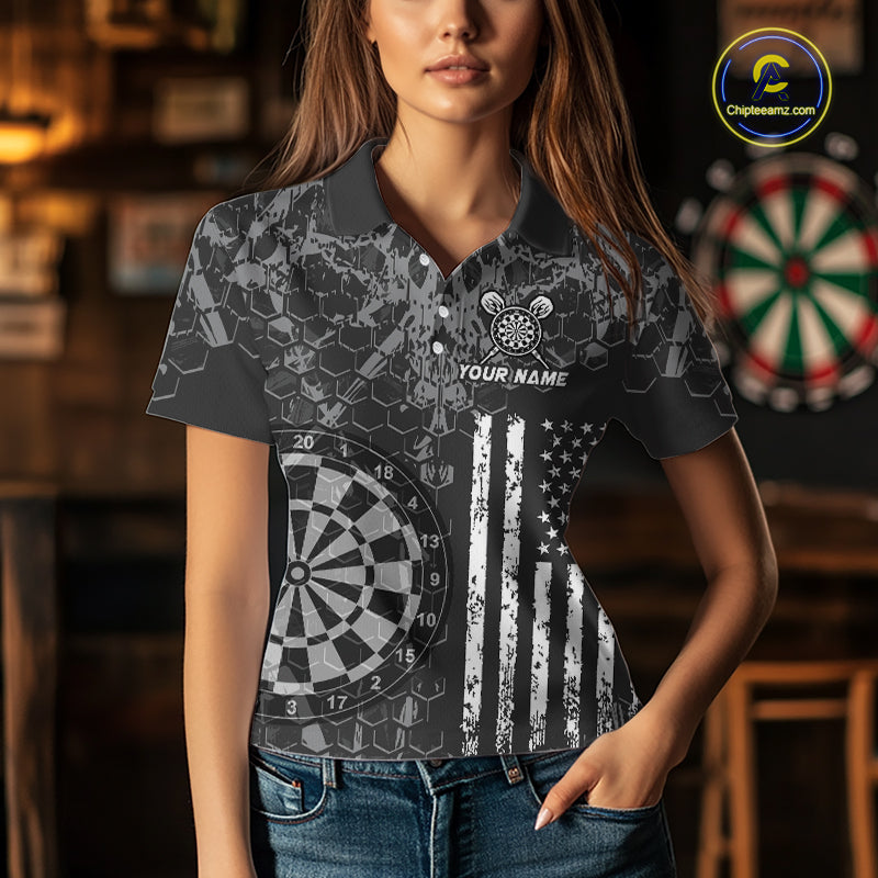 Women wearing darts polo shirt featuring dartboard graphics blended with a american flag flag pattern on a black gray background.