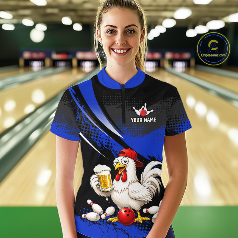 Woman wearing a blue and black bowling quarter zip featuring a chicken holding a beer mug, red bowling ball, scattered pins, and custom your name text.