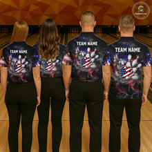 Load image into Gallery viewer, Four people wearing black patriotic bowling polo with smoky flag graphics, custom team text, and an American flag bowling ball striking pins.