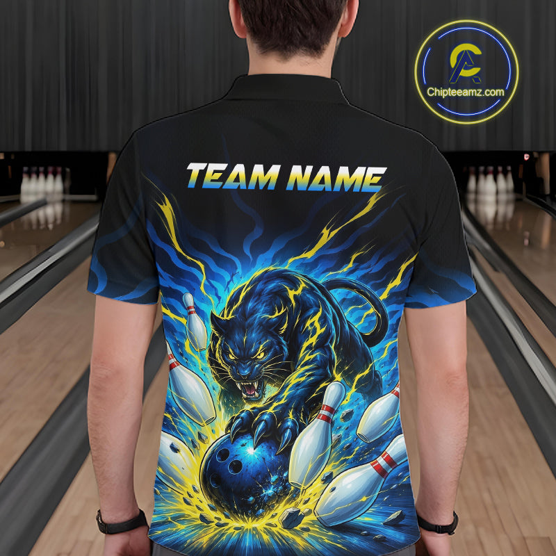 Person wearing a black bowling shirt with a colorful design and 'TEAM NAME' text in a bowling alley.