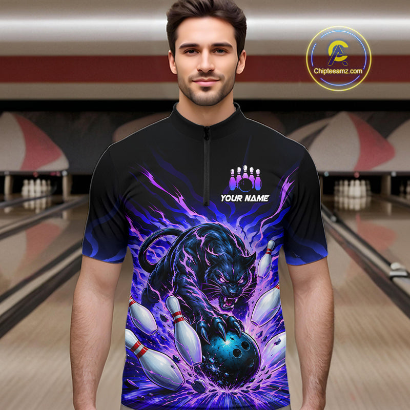 Man wearing a black and purple bowling shirt with a panther design in a bowling alley.