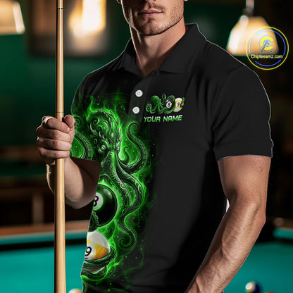 Man wearing a black polo shirt with a green design and pool cue in a billiards setting