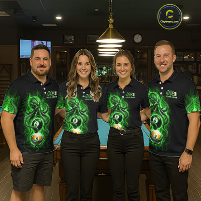 Four people wearing matching black shirts with green designs in a bar setting.