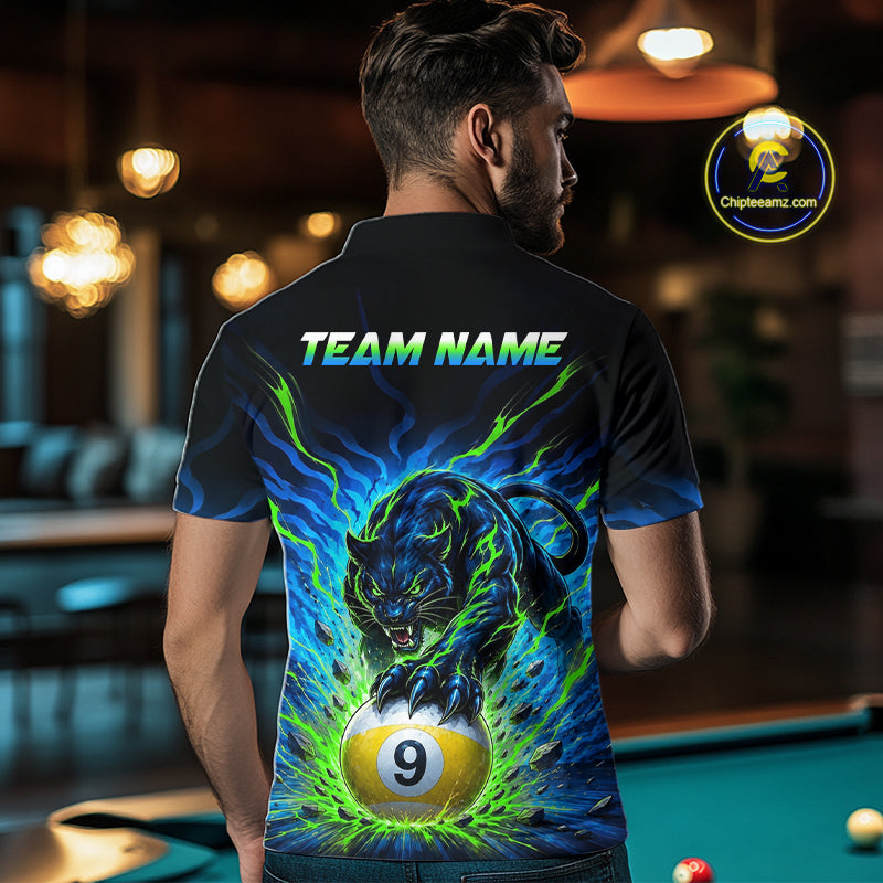 Person wearing a shirt with a panther and pool ball design, standing in a bar.