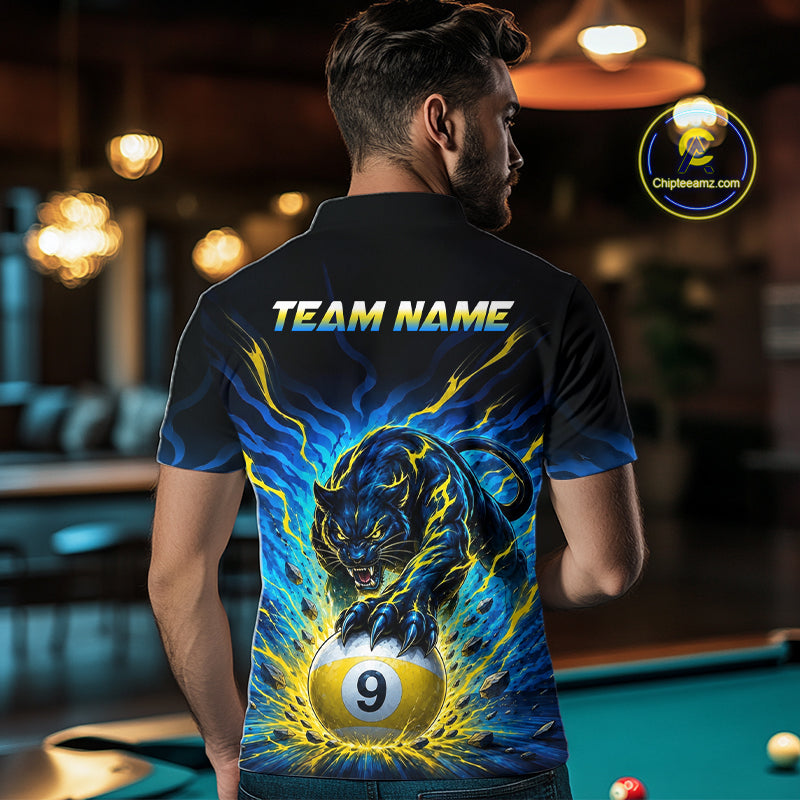 Person wearing a shirt with a panther and pool ball design, standing in a bar.