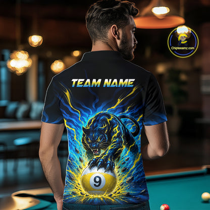 Person wearing a shirt with a panther and pool ball design, standing in a bar.