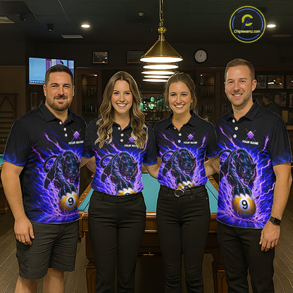 Four people wearing matching polo shirts with a graphic design in a bar setting.