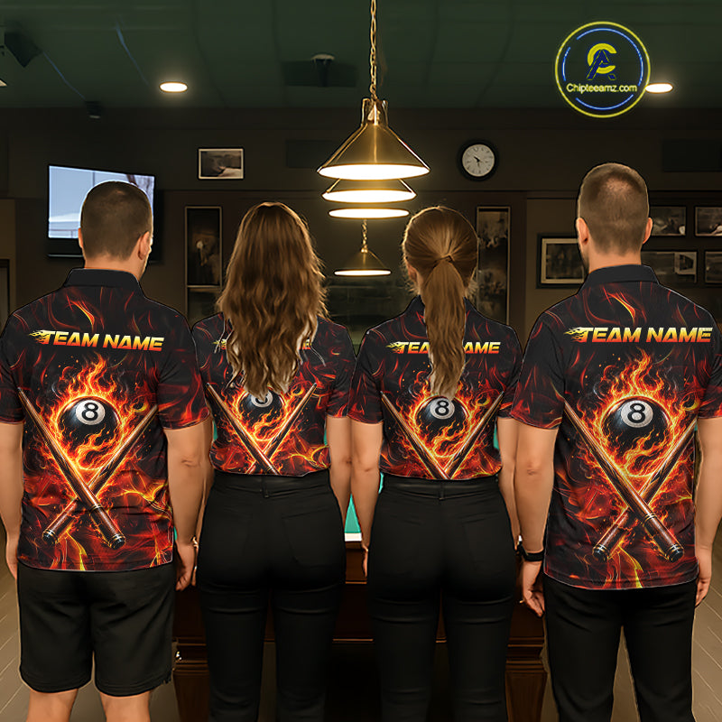 Four people wearing matching shirts with a pool ball and cue design in a pool hall.