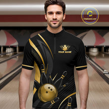 Load image into Gallery viewer, Man wearing a black and gold bowling shirt with a logo and text in a bowling alley.